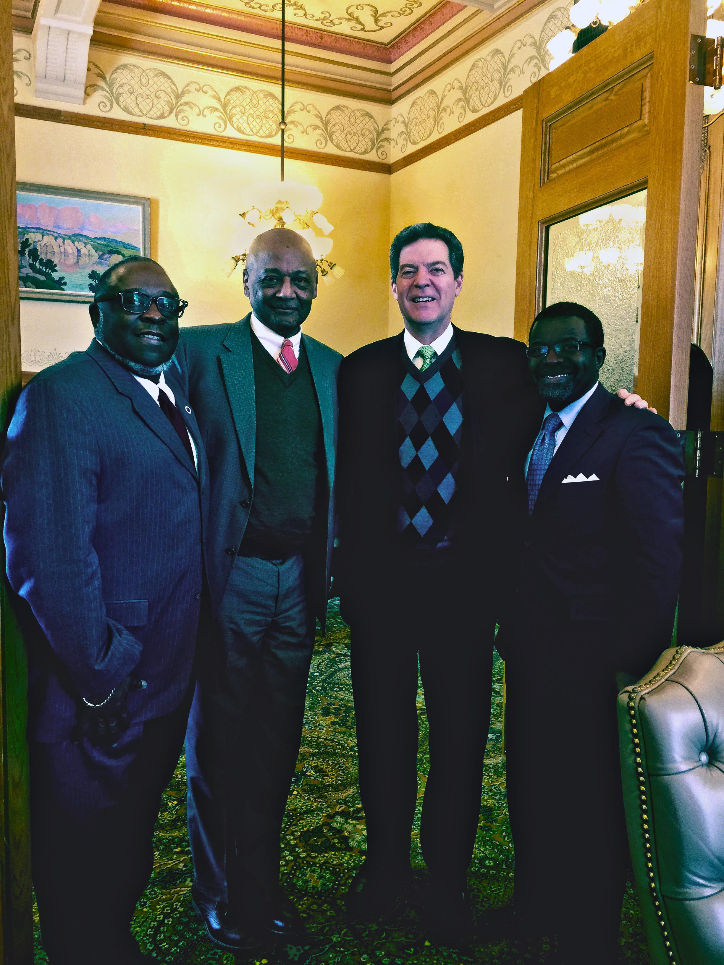 Charles Perry, Robert Woodson, Sr., Governor Brownback and Terence Mathis.